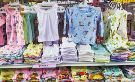 BALI, INDONESIA-AUGUST 18 2021:Clandy's grosir in Tabanan City, all kids cloths placed in order and offer for the costumer.のeditorial素材