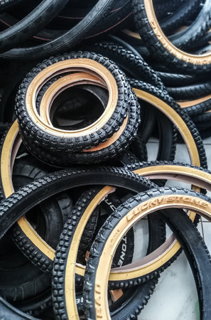 BALI, INDONESIA-AUGUST 26,2021:Tabanan regency of Bali during day time. Bicycle tire placed on the floor, looks they have mostly brown and black colorのeditorial素材