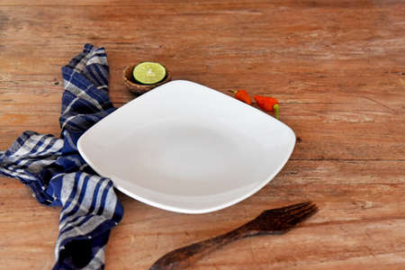 Empty plate isolated on color backgroundの写真素材