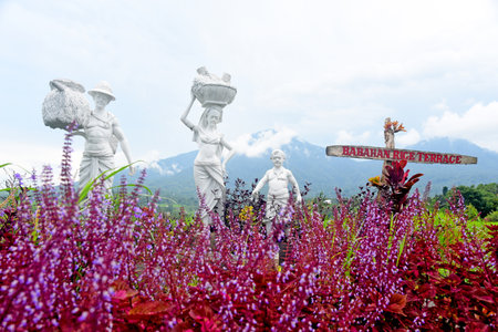 BALI,INDONESIA - March 22 2022 : Statue of the ricefarmer famiy,at Babahan village ,at Tabanan regency of Bali Indonesiaのeditorial素材