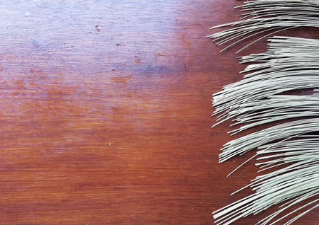 Cleaned,cuted,bamboo sticks,placed on brown wooden background