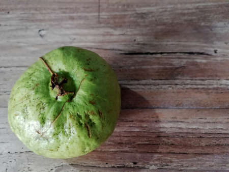 Guajava ftuit, in Indonesian language names (Jambu Kristal ),placed on wooden backgroundの写真素材