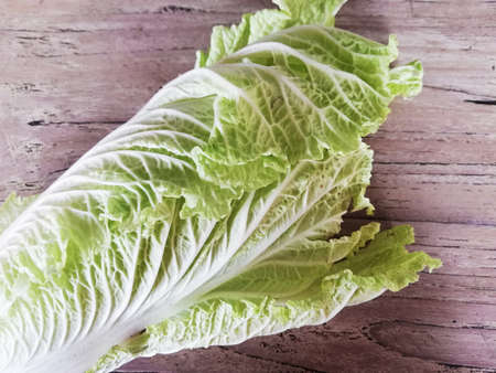 Chinese cabbage,placed on brown wooden backgroundの写真素材