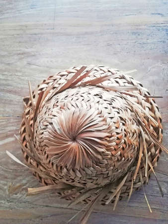 Traditional Balinese Indonesia farmer's hut,coconut leaf material,placed on brown wooden backgroundの写真素材