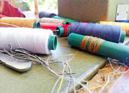 Groups of colorful sewing thread at the taylor workshop