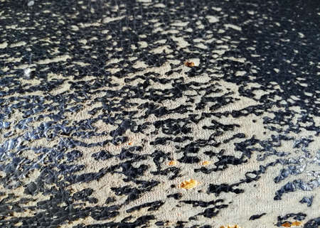 Close up of old,broken sofa sponge in brown black color