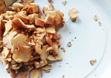 Chopped fresh ginger placed on the white plate