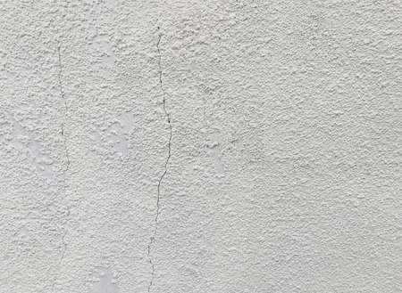 Close up of cracked,weathered wall backgroundの写真素材