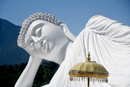 Tabanan,Bali,Indonesia - July 03,2022:Beautiful,big and famous statue of "Laying Budha",at Vihara Dharma Giri temple,in Pupuan village,Tabanan regency,Bali,Indonesia.のeditorial素材