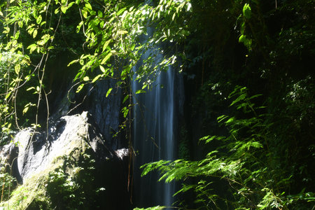Krisik Waterfall at Bangli regency of Bali, with beautiful nature landscape surroundingsの写真素材