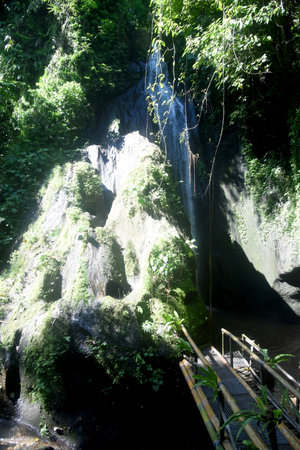 Waterfall in deep forest at Borneo, Sabah, Krisik Waterfall at Bangli regency of Bali, with beautiful nature landscape surroundingsの写真素材