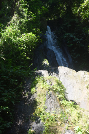 Krisik Waterfall at Bangli regency of Bali, with beautiful nature landscape surroundingsの写真素材