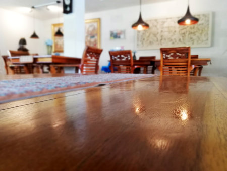 Wooden table in close up , with blurry background