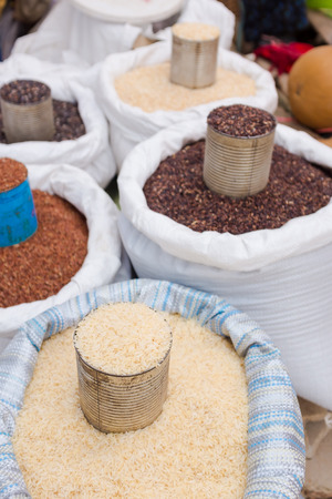 various types of raw rice selling in the marketの写真素材