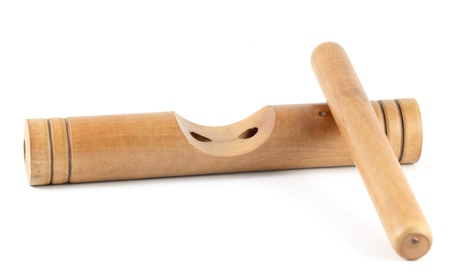Wooden claves isolated on a white background.の写真素材