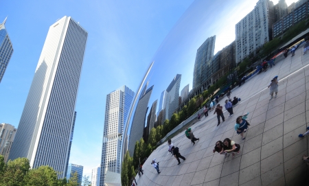 Chicago, Illinois, USA - May 16, 2013  People gather at Cloud Gate to take pictures of themselves and the Chicago skyline reflected on its surface のeditorial素材