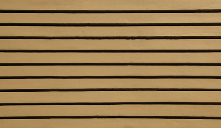 Brown wood siding forms a regular pattern that can be used for backgrounds.の写真素材