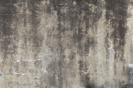 Stained cement wall forms an irregular pattern that can be used for backgrounds.の写真素材