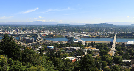 City of Portland: View of South Waterfront and East Portland as seen from Marquam Hill, west of the Willamette River. In view are Marquam Bridge (left), Tilikum Crossing (center), and Ross Island Bridge (right).の写真素材