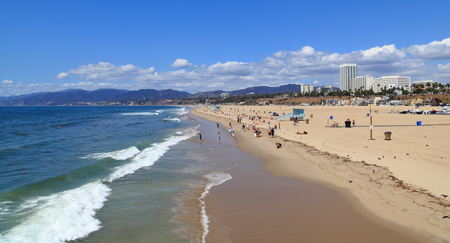 SANTA MONICA - SEP 16: Beach-goers relax under a sunny sky on Sep 16, 2015 in Santa Monica. Photographed from the famous Santa Monica Pier.のeditorial素材