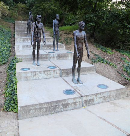 PRAGUE - SEP 5: Bronze statues honoring victims of communism on Sep 5, 2013 in Prague. Unveiled on May 22, 2002, it is located at the foot of PetÅÃ­n hill, Ãjezd street in the MalÃ¡ Strana.のeditorial素材