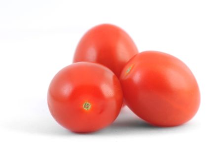 Cherry tomatoes on a white background の写真素材