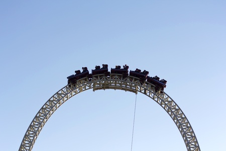 Image of a dark roller coaster on a blue backgroundの写真素材