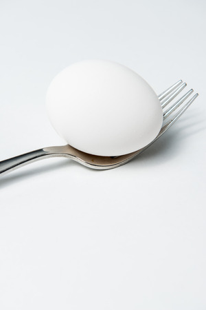 Egg on a shiny Forkの写真素材