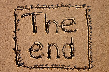 The end, written on a beach.  Good for a holiday film ending.の写真素材