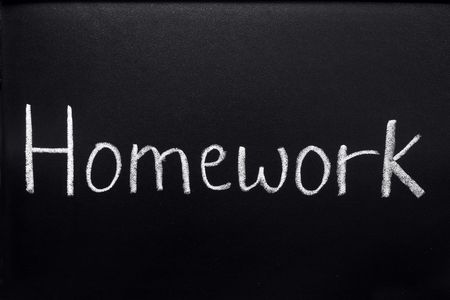 Homework, written on a blackboard.の写真素材