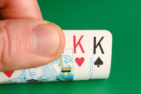 Looking at pocket Kings (Cowboys) during a poker gameのeditorial素材