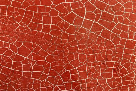 Abstract red background.  A boat hull with red paint and white cracked lines.の写真素材