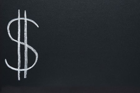 The US Dollar currency symbol, written on a blackboard, with space for text.の写真素材