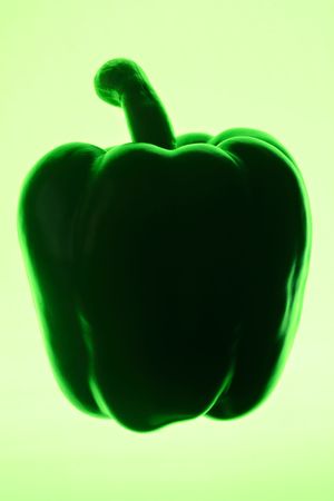 Green bell pepper silhouette on a green background.