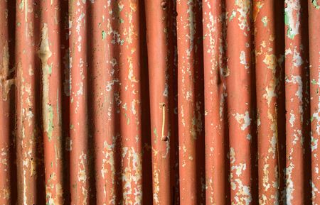 An old rusty corrugated iron fenceの写真素材
