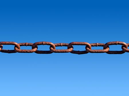 Rusty metal chain links and a blue sky.