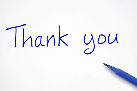 Thank you, written with a blue felt tip pen.の写真素材