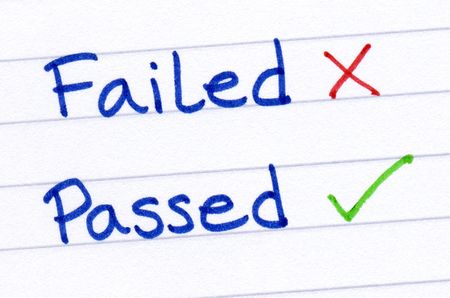 Failed and passed written on white paper.の写真素材