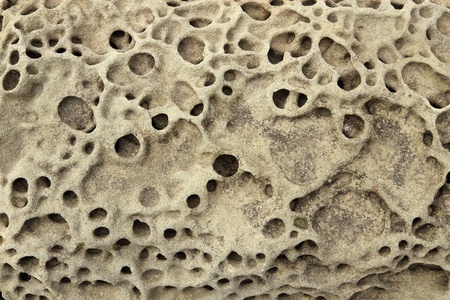 Rock erosion holes sea wall in Western-Super-Mare.の写真素材