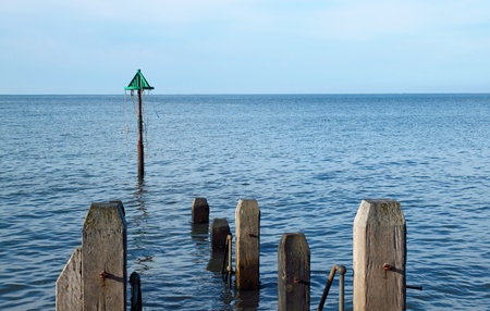 Aberystwyth wooden jetty with a calm sea, Wales UK.の写真素材