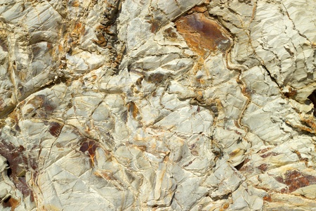 Coast cliff rock face close up.