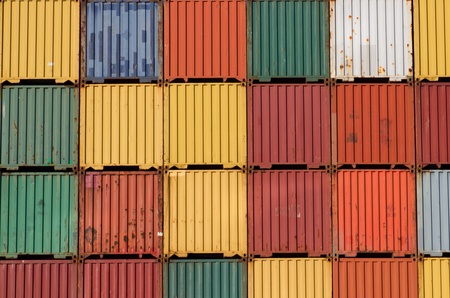 Colorful ship cargo containers stacked up in a port.の写真素材