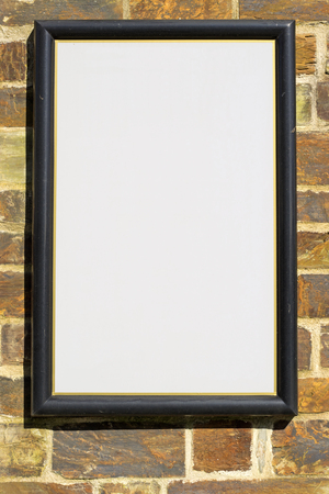 White blank sign on a stone wall.の写真素材