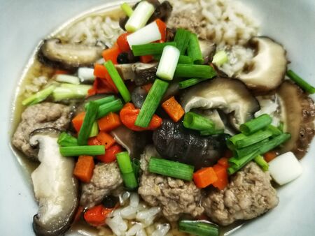 Boiled Minced Pork Porridge Add shiitake mushrooms and carrots, garnish with spring onions to add color. Smell and tasteの写真素材