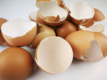 Waste eggs with a white backgroundの写真素材