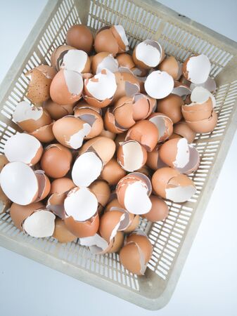 Waste eggs in a basket with a white background.