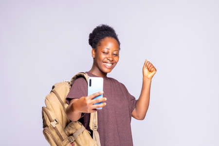 Yes, Excellent News. Smiling Young Lady Having Success, Holding Cellphone, Portrait Of Excited black...
