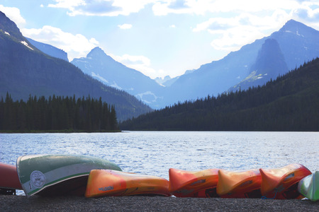 Beautiful lake with mountain around and boats foregroundの写真素材