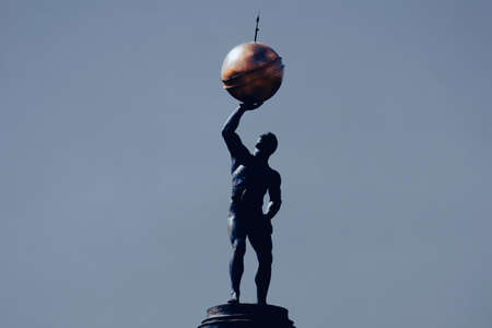 A statue of Atlas holding the celestial spheresの写真素材
