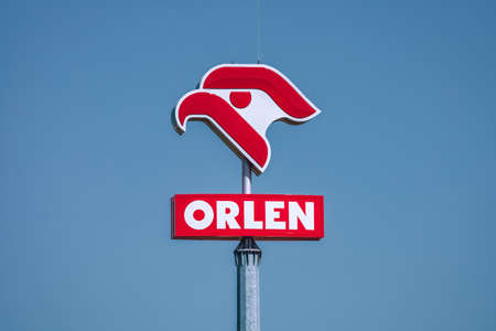 PKN Orlen logo with a blue sky background. Orlen is a state-owned oil refiner and the largest petrol retailer in Poland.のeditorial素材